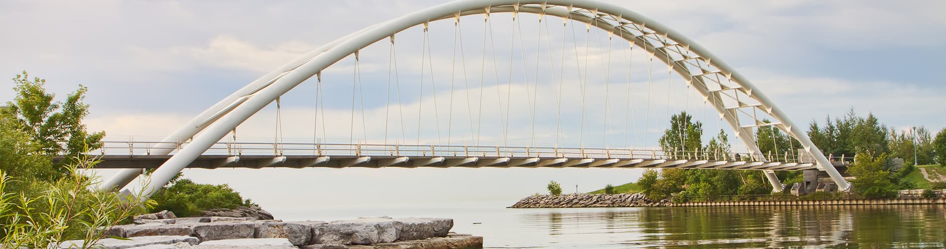 Scenic view of Humber Bay Arch Bridge over calm water